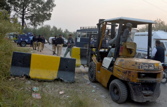 containers were being removed from the peshawar islamabad motorway and gt road when this report was filed photo mudassar raja express containers were being removed from the peshawar islamabad motorway and gt road when this report was filed photo mudassar raja express
