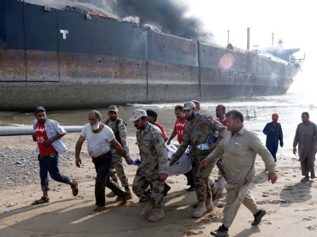emergency services gather around the wreckage of a burning ship after a gas cylinder explosion at the gadani shipbreaking yard photo inp emergency services gather around the wreckage of a burning ship after a gas cylinder explosion at the gadani shipbreaking yard photo inp