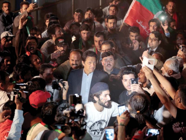 pti chairman imran khan is surrounded by his supporters in islamabad photo reuters pti chairman imran khan is surrounded by his supporters in islamabad photo reuters