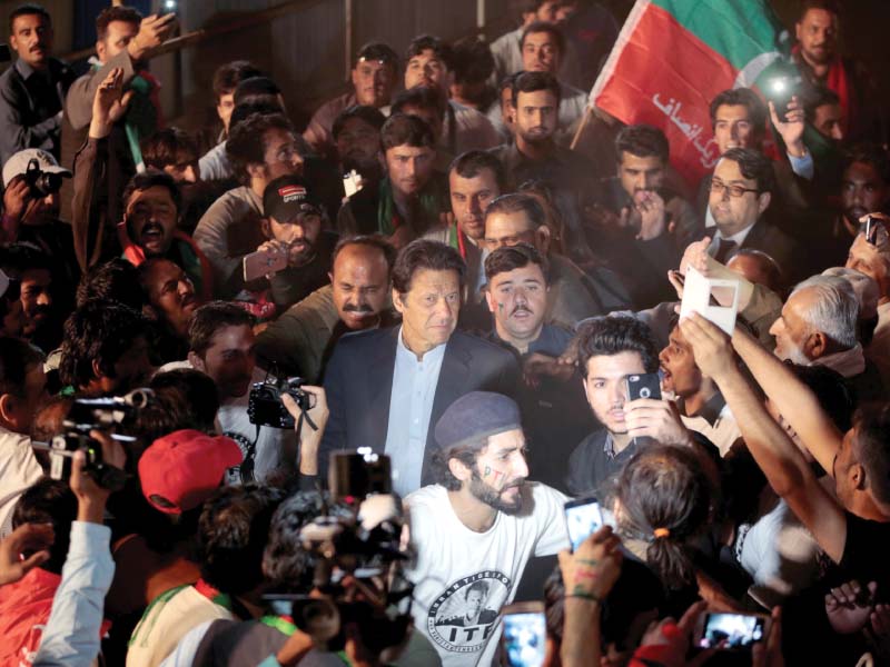 pti chairman imran khan is surrounded by his supporters in islamabad photo reuters