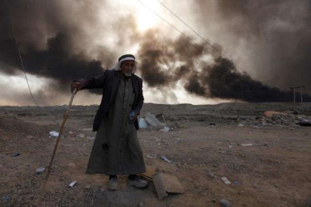 a man returns to his village after it was liberated from islamic state militants photo reuters