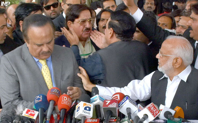 awami muslim league chief sheikh rashid ahmed tries to calm down pakistan awami tehreek leader khurram nawaz gandapur after a heated exchange of words broke out between the pat leader and pakistan tehreek e insaf spokesperson naeemul haq who is also visible in the picture on thursday november 3 2016 photo inp