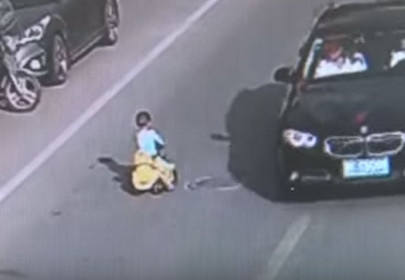 boy rides toy car into oncoming traffic in china boy rides toy car into oncoming traffic in china