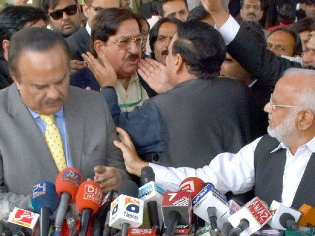 awami muslim league chief sheikh rashid ahmed tries to calm down pakistan awami tehreek leader khurram nawaz gandapur after a heated exchange of words broke out between the pat leader and pakistan tehreek e insaf spokesperson naeemul haq who is also visible in the picture on thursday november 3 2016 photo inp