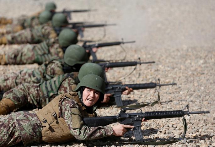 sabera 23 a soldier from the afghan national army ana gestures during a shooting exercise at the kabul military training centre kmtc in kabul afghanistan photo reuters