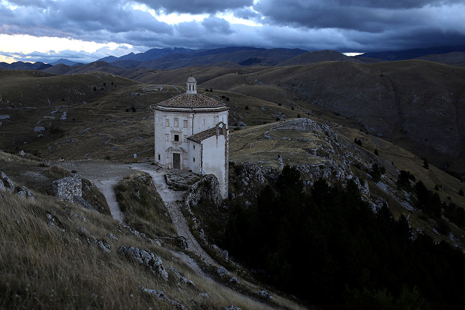 a church stands isolated from other buildings in the small town of rocca calascio close to santo stefano di sessanio in the province of l 039 aquila in abruzzo inside the national park of the gran sasso e monti della laga italy photo reuters