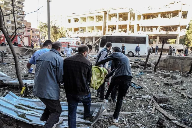 rescue officials and people carry an injured man at the explosion site on november 4 2016 after a strong blast in the southeastern turkish city of diyarbakir at least one person was killed and 30 injured in a blast outside a police building on november 4 in diyarbakir photo afp rescue officials and people carry an injured man at the explosion site on november 4 2016 after a strong blast in the southeastern turkish city of diyarbakir at least one person was killed and 30 injured in a blast outside a police building on november 4 in diyarbakir photo afp