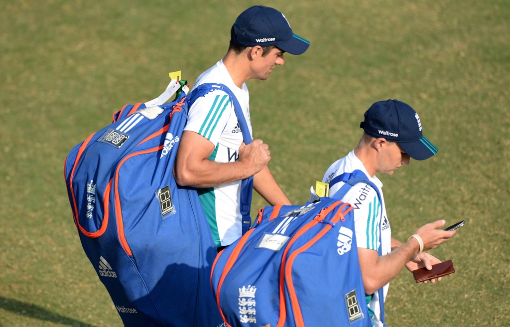 alastair cook l and joe root arrive for a training session in mumbai photo afp