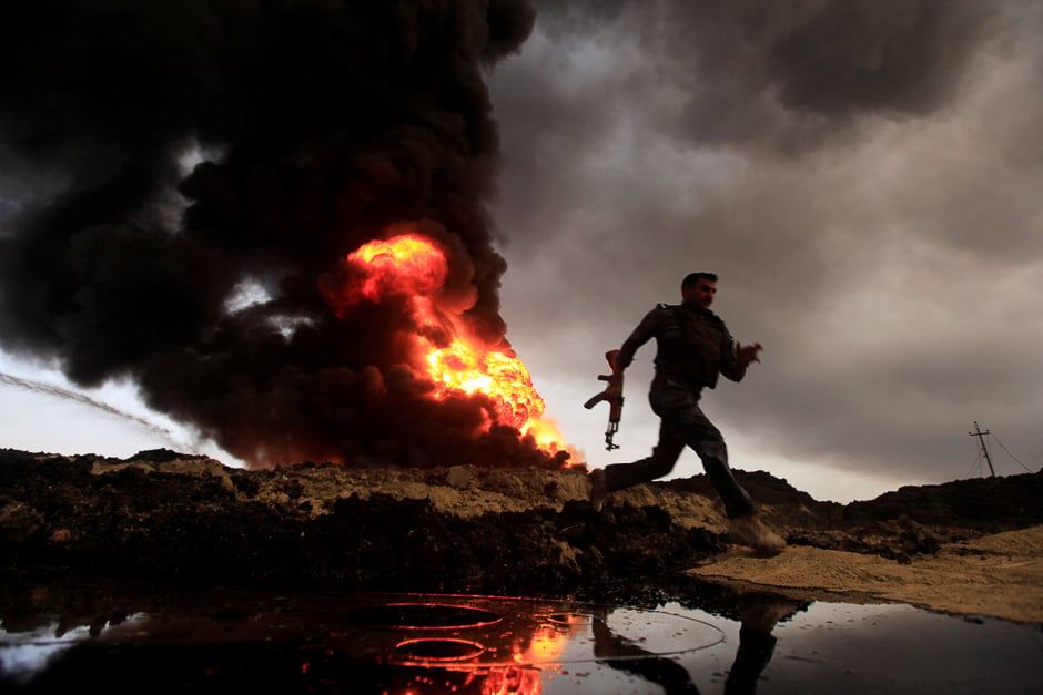 flames and smoke rise from oil wells set ablaze by islamic state militants before they fled the oil producing region of qayyara iraq photo reuter