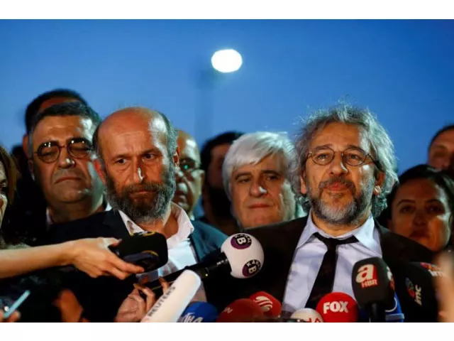 can dundar r editor in chief of cumhuriyet accompanied by his ankara bureau chief erdem gul talks to media as they leave at the justice palace in istanbul turkey may 6 2016 photo reuters can dundar r editor in chief of cumhuriyet accompanied by his ankara bureau chief erdem gul talks to media as they leave at the justice palace in istanbul turkey may 6 2016 photo reuters