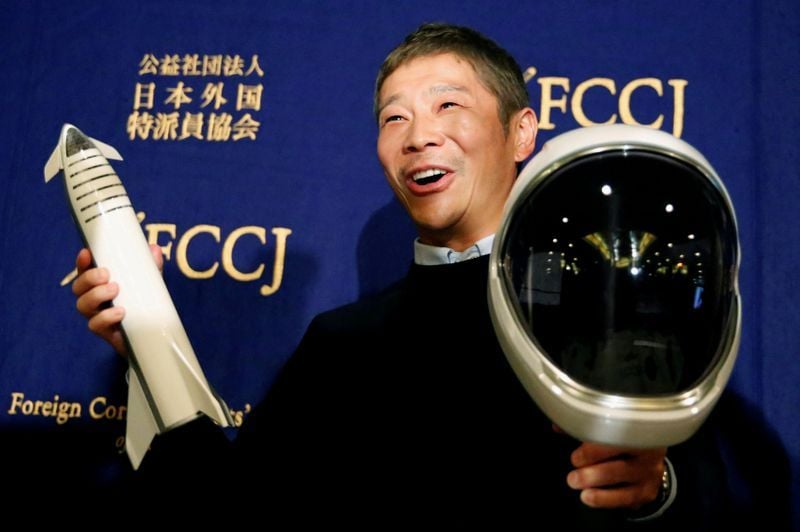 japanese billionaire maezawa founder of online fashion retailer zozo who has been chosen as the first private passenger by spacex poses for photos as he attends a news conference in tokyo photo reuters