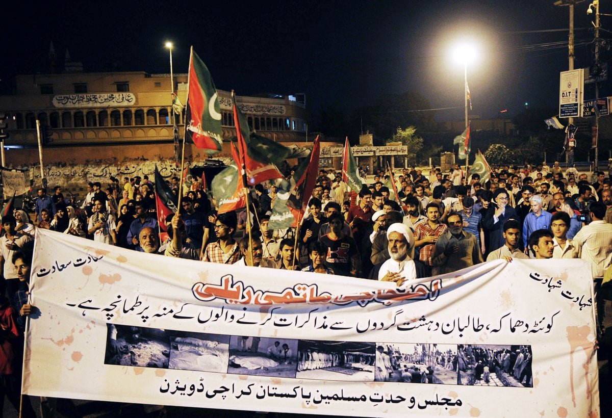 protesters march against the overnight suicide bombing on their community members in karachi on july 1 2013 photo afp