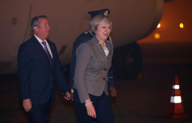 britain 039 s prime minister theresa may walks towards her car after her arrival at the airport in new delhi india photo reuters