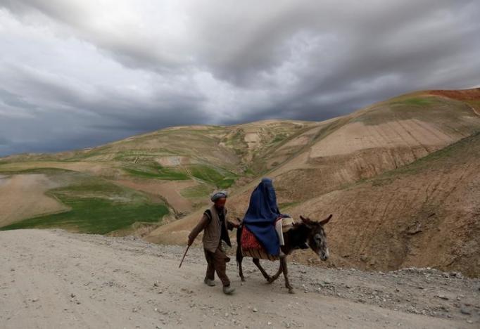 an afghan family travels with a donkey in the argo district in badakhshan province photo reuters