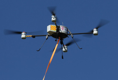 new quadcopter tech allows drones to recharge on power lines new quadcopter tech allows drones to recharge on power lines