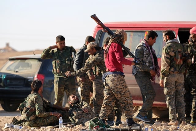 members of us backed kurdish arab forces deploy on the frontline one kilometre from the syrian town of ain issa some 50 kilometres 30 miles north of raqa on november 6 2016 as they launched an offensive on the islamic state group 039 s de facto syrian capital the start of the assault by the syrian democratic forces sdf came as iraqi forces fought inside mosul for the third day running amid fierce jihadist resistance photo afp