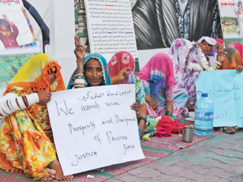 protesters sitting outside the karachi press club during the demonstration the protesters from thar pleaded to the government not to take away their livelihoods photo ayesha mir express