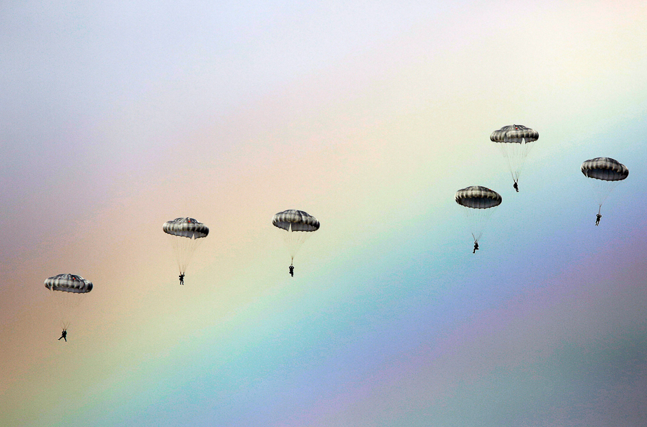 russian paratroopers jump as a rainbow appears in the sky during the joint russian belarusian and serbian military exercise quot the slavic brotherhood quot at the military ground kovin near belgrade photo afp