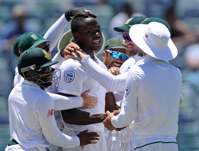 south african bowler kagiso rabada c is embraced by teammates after he had taken his fifth wicket on day five of the first test cricket match between australia and south africa in perth on november 7 2016 photo afp