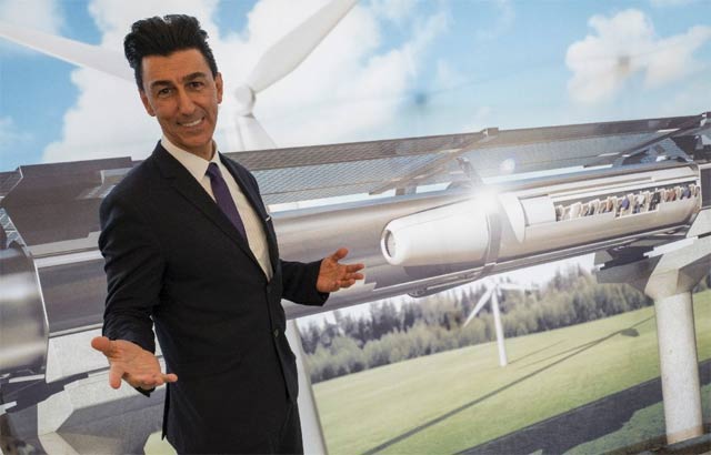 chairman of hyperloop transportation technologies inc bibop gresta poses in front of a rendering of the hyperloop technology at innotrans in berlin photo afp