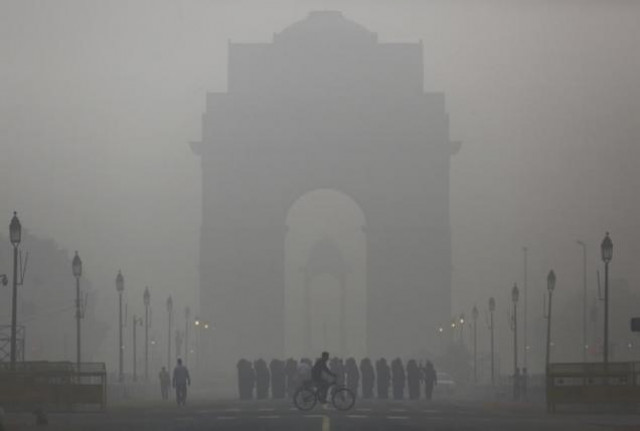 a man rides his bicycle next to indian soldiers marching in front of india gate on a smoggy morning in new delhi india december 1 2015 photo reuters a man rides his bicycle next to indian soldiers marching in front of india gate on a smoggy morning in new delhi india december 1 2015 photo reuters