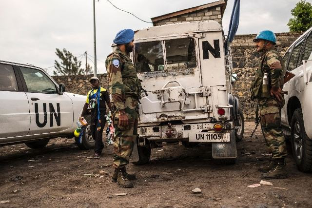 indian blue helmet peacekeepers stand guard next to united nations vehicles in goma on november 8 2016 photo afp indian blue helmet peacekeepers stand guard next to united nations vehicles in goma on november 8 2016 photo afp