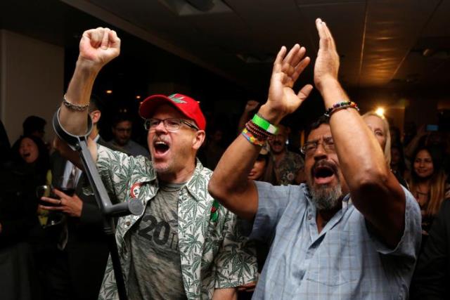 william britt l and al moreno r celebrate after californians voted to pass prop 64 legalizing recreational use of marijuana in the state in los angeles california us november 8 2016 photo reuters