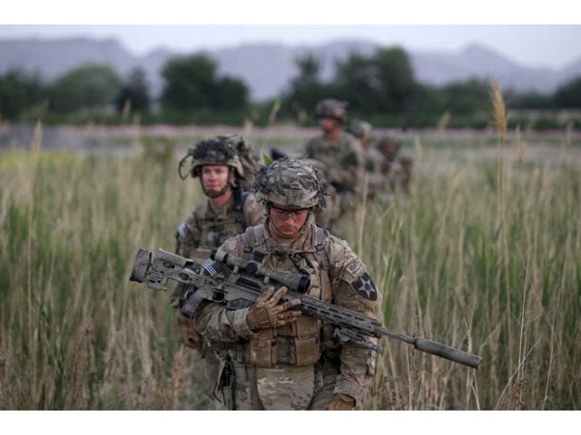 us soldiers from 5 20 infantry regiment attached to 82nd airborne walk while on patrol in zharay district in kandahar province southern afghanistan april 24 2012 photo reuters