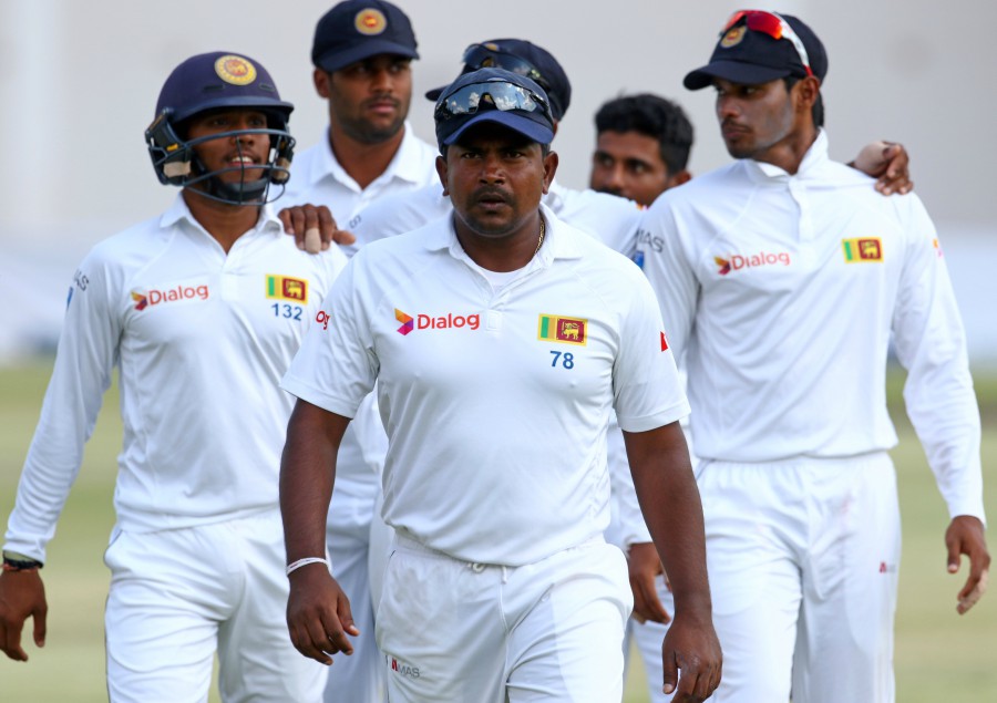 rangana herath leads the team after taking another five wicket haul in the second test against zimbabwe on november 9 2016 photo afp