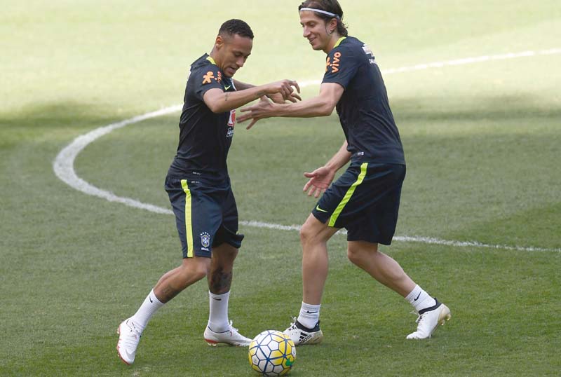 brazil s footballer neymar l and teammate filipe luis take part in a training session at the mineirao stadium in belo horizonte photo afp