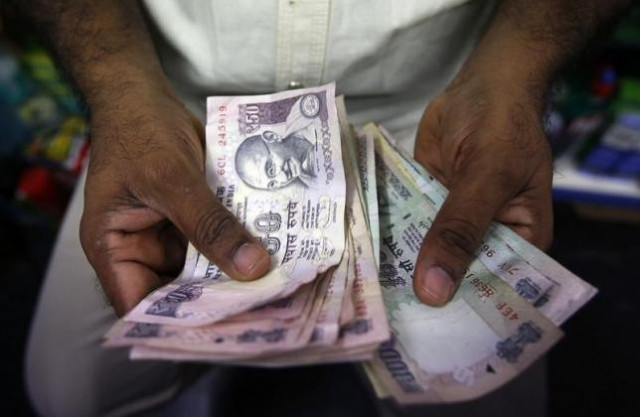 newly designed 500 and 1 000 rupee bills will be rolled out at a later date photo reuters newly designed 500 and 1 000 rupee bills will be rolled out at a later date photo reuters