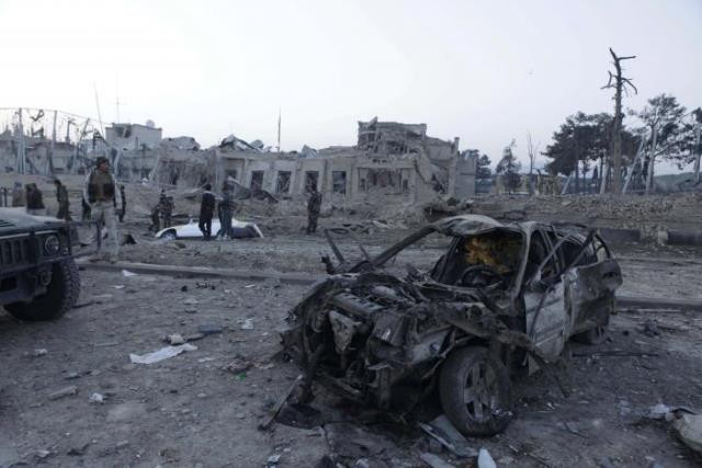 afghan security forces investigate at the site of explosion near the german consulate office in mazar i sharif afghanistan november 11 photo reuters afghan security forces investigate at the site of explosion near the german consulate office in mazar i sharif afghanistan november 11 photo reuters
