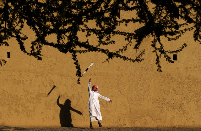 an emirati child practices a traditional dance during the third edition of the souq al qattara festival in al ain on the outskirts of abu dhabi photo afp
