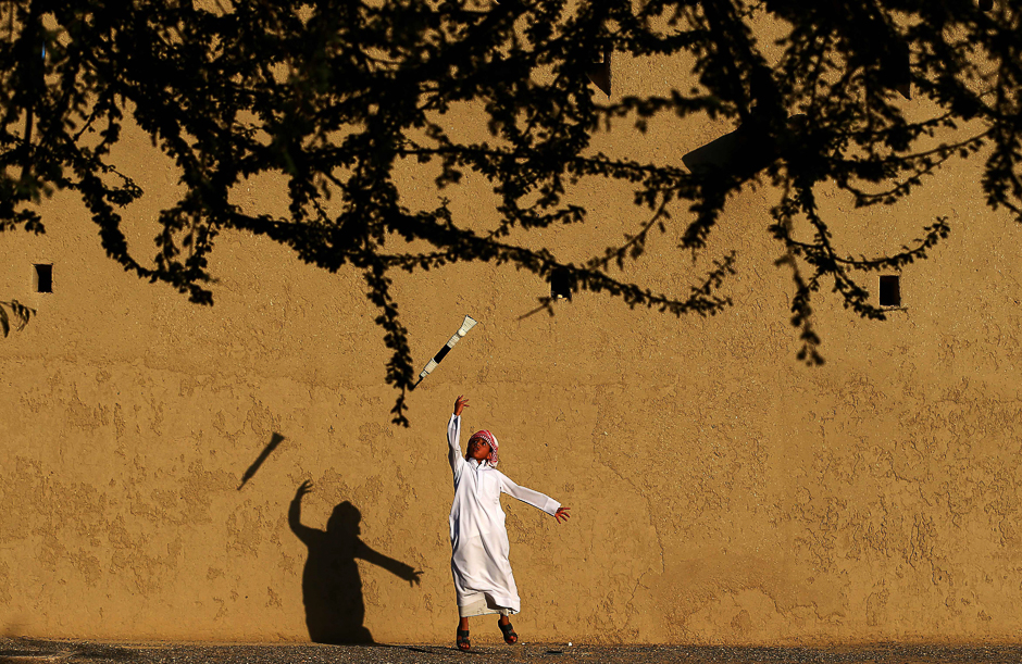 an emirati child practices a traditional dance during the third edition of the souq al qattara festival in al ain on the outskirts of abu dhabi photo afp