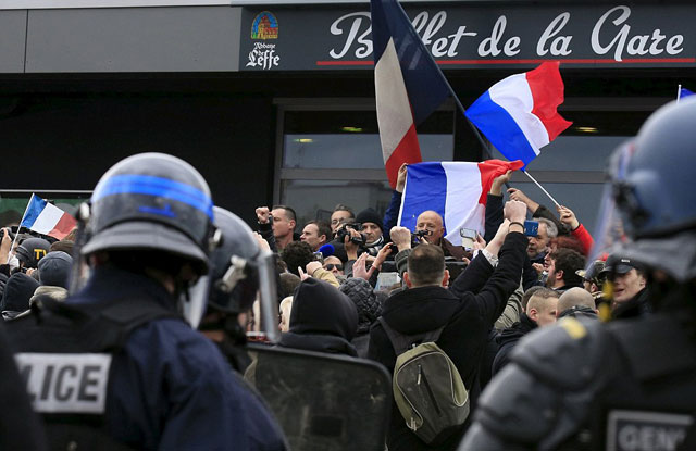 activists against migrants shout slogans as retired french general christian piquemal makes an address during a protest organised by the anti islam group pegida in calais northern france where many migrants have set up camp to seek refuge in western europe photo reuters