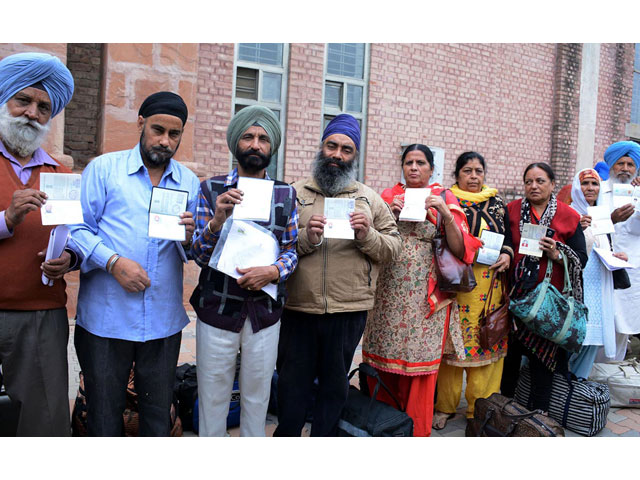 sikh pilgrims from india show their passports at the wagah railway station on november 12 2016 photo online