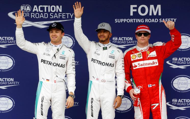 lewis hamilton c celebrates pole position next to nico rosberg and kimi raikkonen photo reuters nacho doce