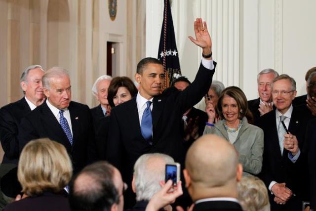 u s president barack obama waves to the audience after signing the affordable care act dubbed obamacare the comprehensive healthcare reform legislation during a ceremony in the east room of the white house in washington u s march 23 2010 photo reuters