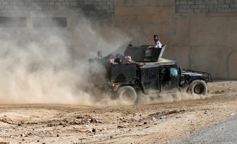 displaced people flee samah neighborhood in a military vehicle of the iraqi army during a fight between the islamic state militants and the iraqi counter terrorism service in mosul november 13 2016 photo reuters