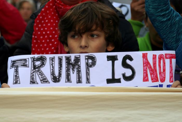 a boy holds a sign during a protest against us president elect donald trump in manhattan new york us photo reuters
