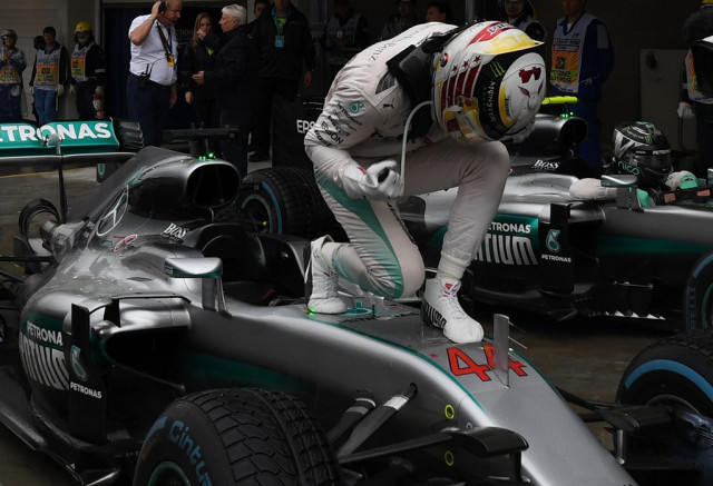 lewis hamilton celebrates winning the brazilian grand prix at the interlagos circuit in sao paulo brazil on november 13 2016 photo afp lewis hamilton celebrates winning the brazilian grand prix at the interlagos circuit in sao paulo brazil on november 13 2016 photo afp