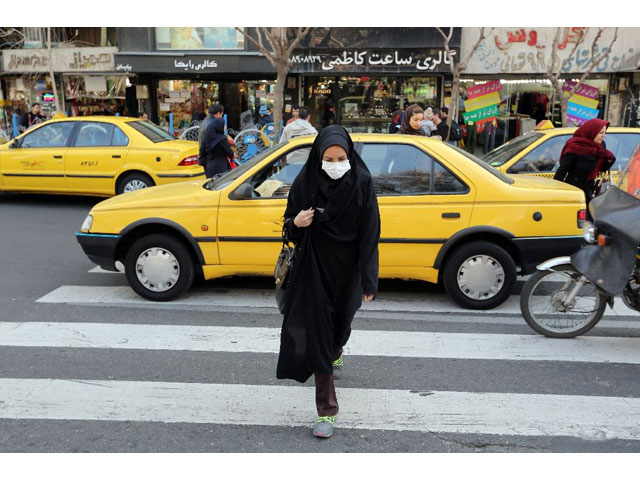 the smog forced many of its 14 million residents to retreat indoors or don face masks in the street photo afp