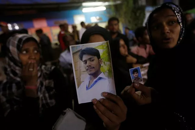 family members show pictures of missing relatives after an explosion in at the shah noorani shrine in baluchistan outside a hospital in karachi november 12 2016 photo reuters family members show pictures of missing relatives after an explosion in at the shah noorani shrine in baluchistan outside a hospital in karachi november 12 2016 photo reuters