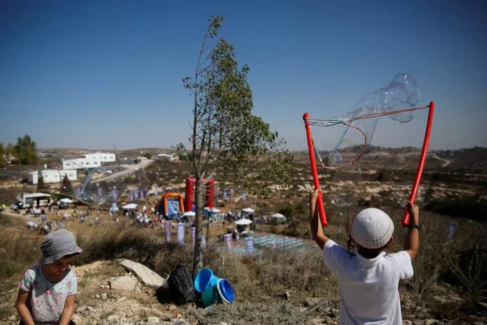 children play during an event organised to show support for the jewish settler outpost of amona in the west bank that was built without israeli state authorisation and which israel 039 s high court ruled must be evacuated and demolished by the end of the year as it is built on privately owned palestinian land photo reuters children play during an event organised to show support for the jewish settler outpost of amona in the west bank that was built without israeli state authorisation and which israel 039 s high court ruled must be evacuated and demolished by the end of the year as it is built on privately owned palestinian land photo reuters