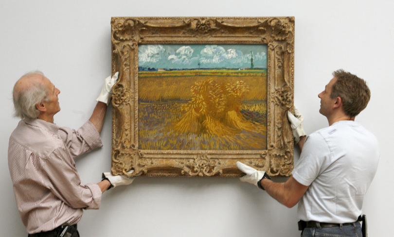 and dieter marti fix the painting 039 wheatfield with sheaves quot from late dutch artist van gogh at a wall at the kunstmuseum basel in 2009 photo reuters