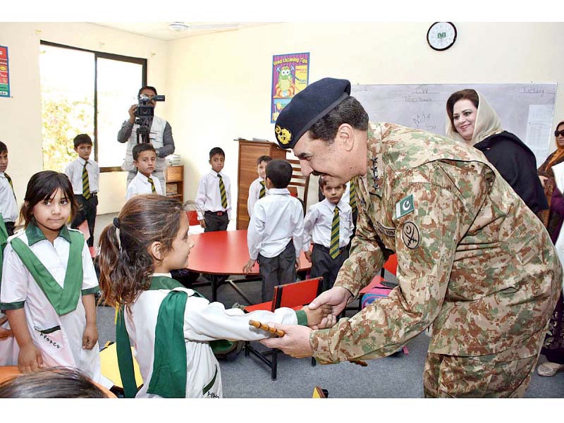 gen raheel sharif greets a student at the army public school in chagmalai photo app