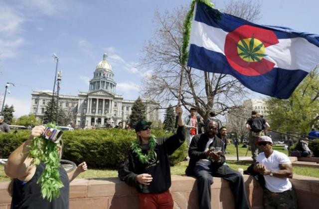 a man waves a colorado flag with a marijuana leaf on it at denver 039 s annual 4 20 marijuana rally in front of the state capitol building in downtown denver april 20 2015 photo reuters a man waves a colorado flag with a marijuana leaf on it at denver 039 s annual 4 20 marijuana rally in front of the state capitol building in downtown denver april 20 2015 photo reuters