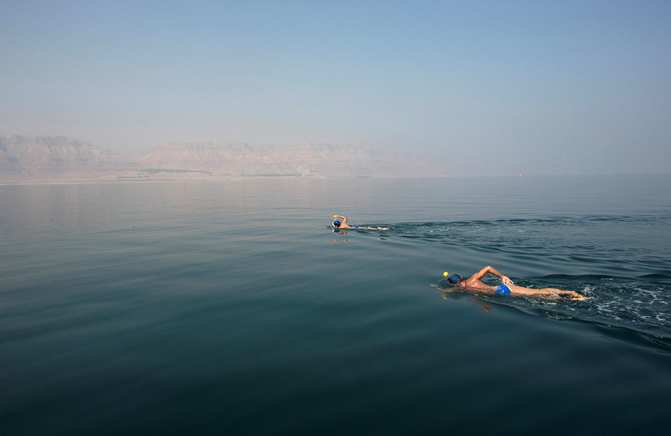 environmental activists take part in quot the dead sea swim challenge quot swimming from the jordanian to israeli shore to draw attention to the ecological threats facing the dead sea in kibbutz ein gedi israel photo reuters