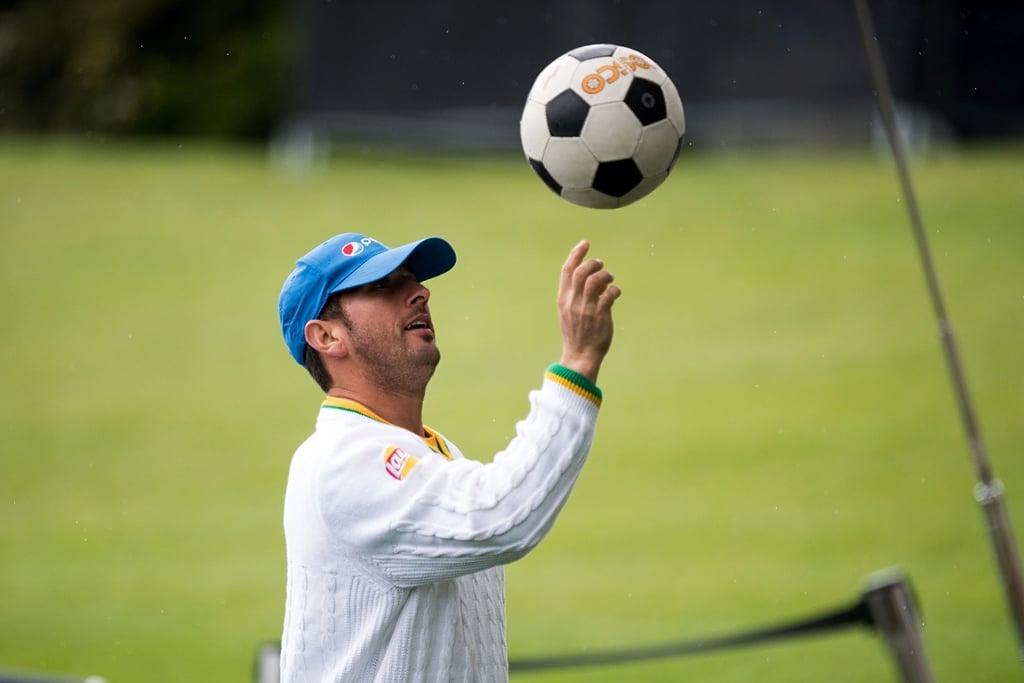 yasir shah plays with a football as rain delays the start of day one at hagley park in christchurch on november 17 2016 photo afp marty melville