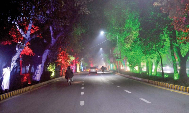 trees along shahrae quaid e azam glow with fairy lights put up by the district administration ahead of the visit of turkish president recep tayyip erdogan who has arrived in pakistan on a two day visit photo zahoorul haq express